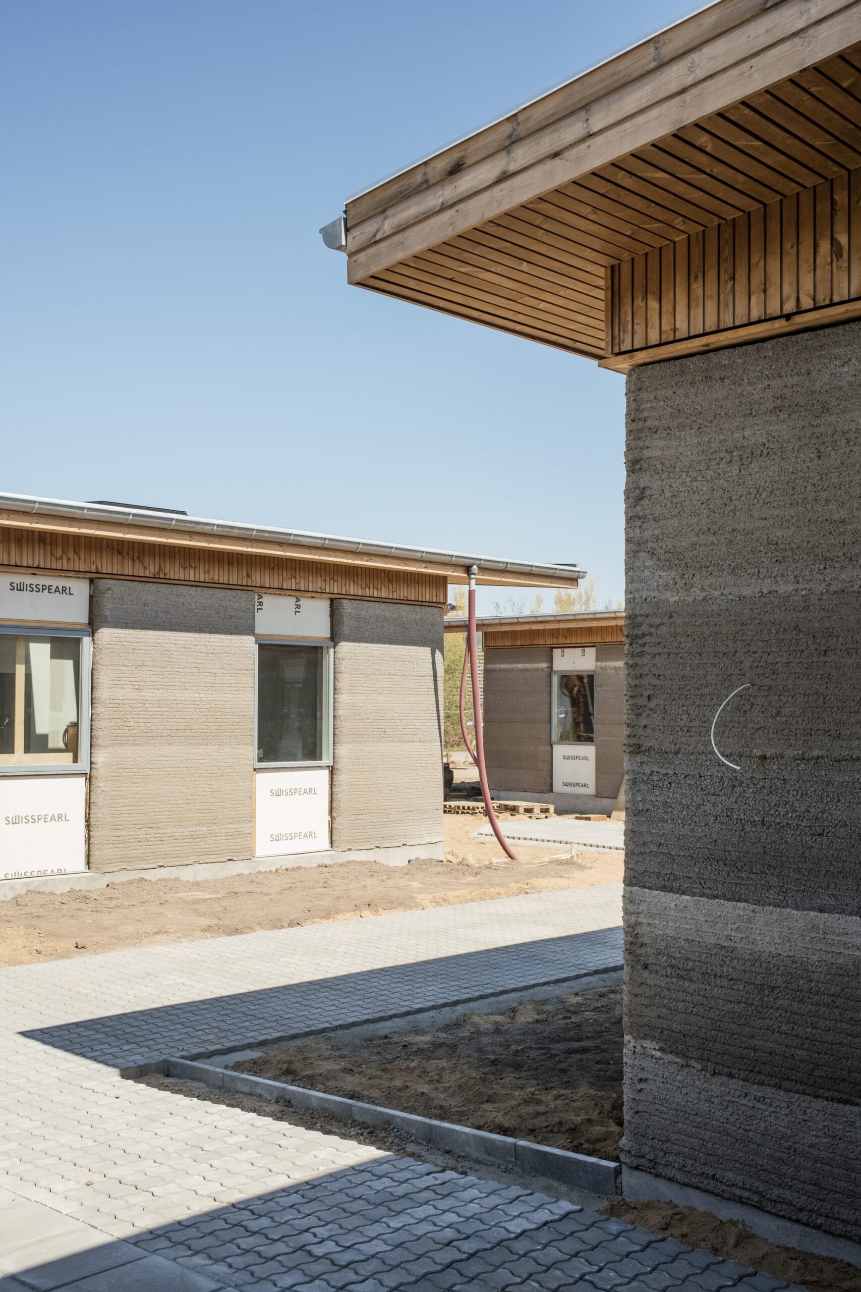Skovsporet-ის ბეჭდვა: ნაბეჭდი კედლები ეზოში. ფოტო: SAGA Space Architects