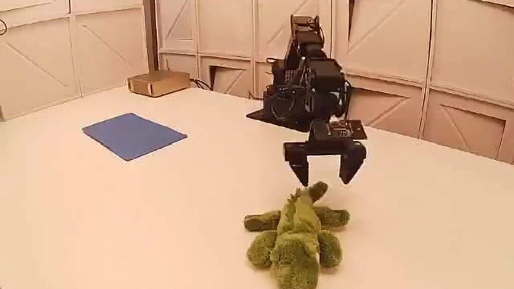 AA-Robotics task: place the crocodile toy in the rectangle (Artificial Analysis)