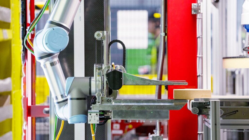 Amazon Vulcan robot with tactile sensing in a fulfillment center
