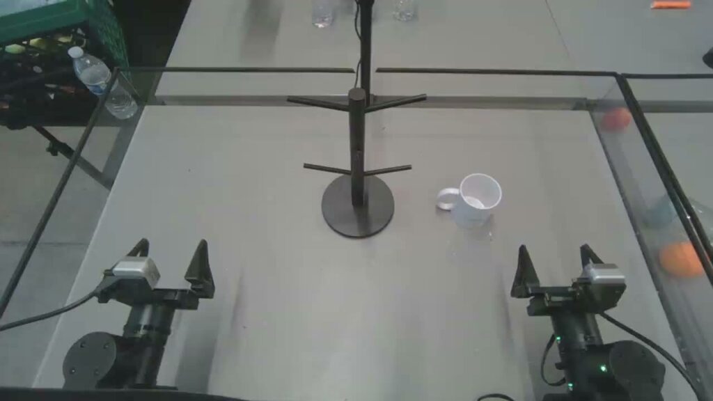 Dream-1 reaching for a mug on a table (Dream Labs)