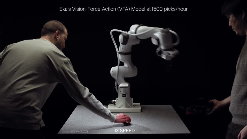 Eka's robot arm picking objects from a table at full speed next to a person (Eka Robotics, still from its demo video)