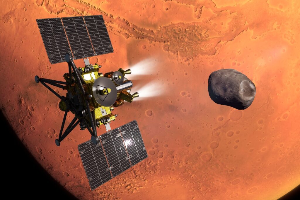 Artist illustration of the MMX spacecraft firing its thrusters near Mars and Phobos (JAXA)