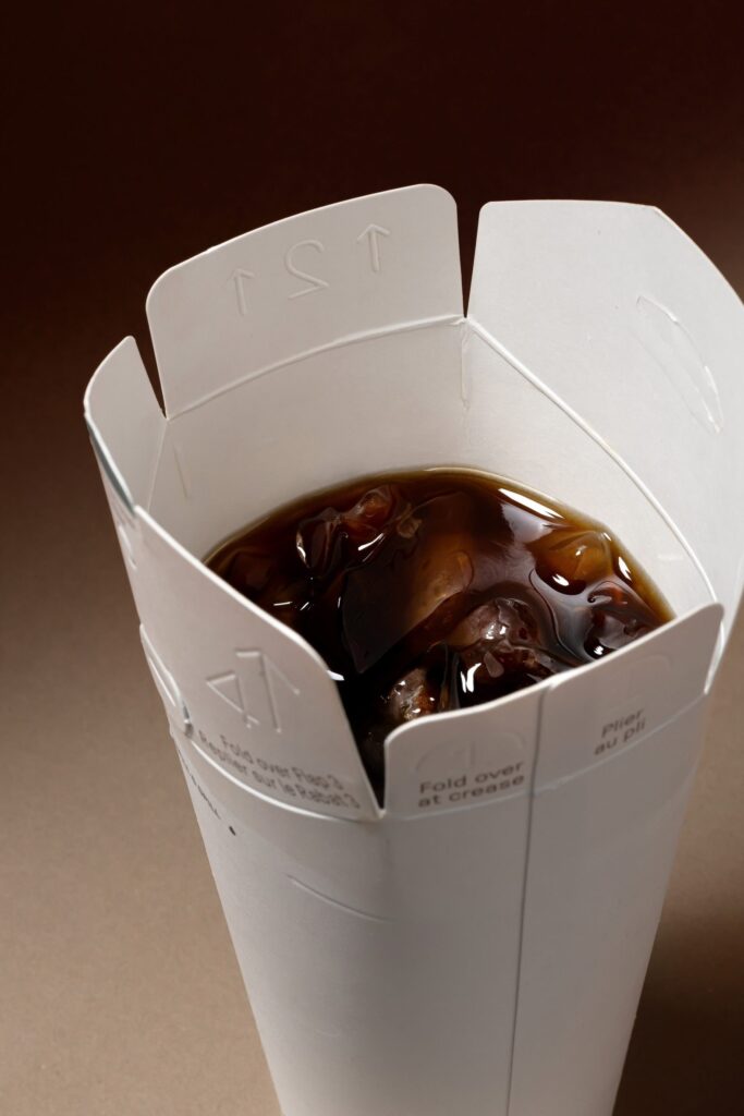 Nothing compostable paper takeaway cup with fold-down lid, photo 1