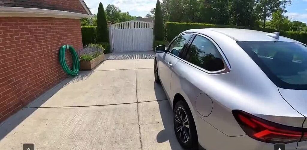 Odyssey-3 generated world: a car in a driveway (Odyssey)