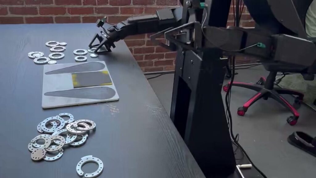 Almond’s Axol robot deburrs parts for its own assembly after four days of Pi API iteration (Physical Intelligence)