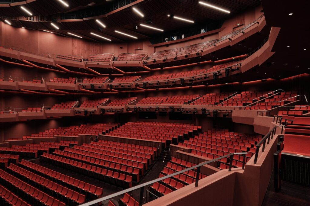 The 2,000 seat Harmony Hall in deep red (Snøhetta via Dezeen)