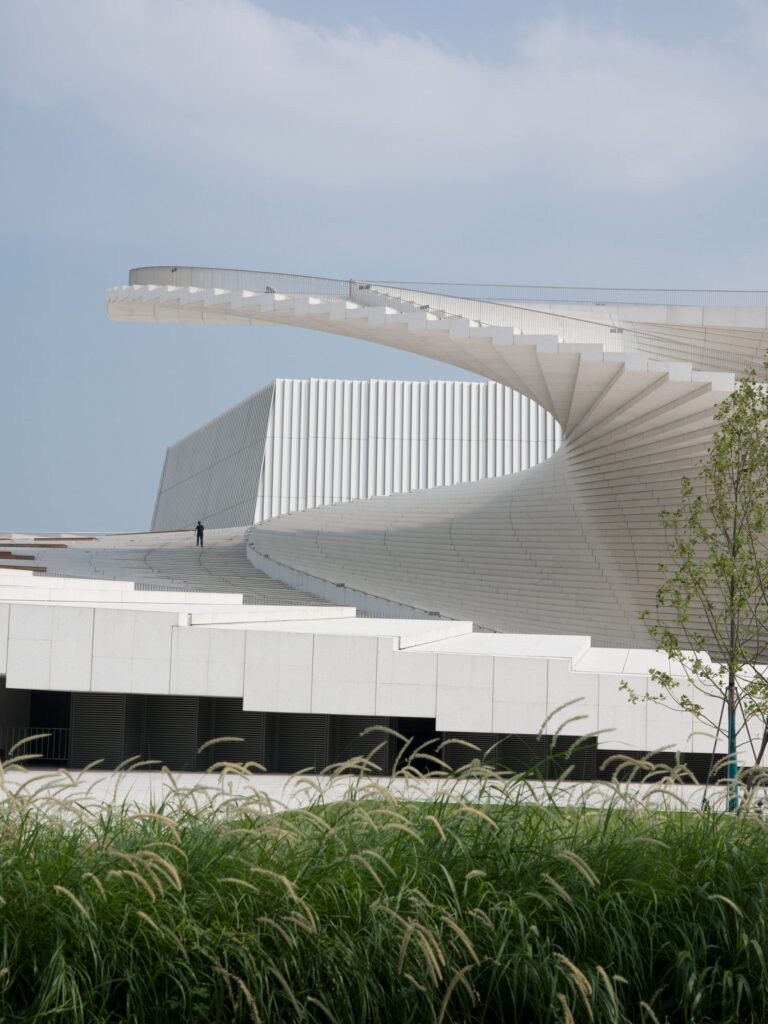 Shanghai Grand Opera House by Snøhetta with its spiral staircase rising to a public roof (Snøhetta), photo 1 (Snøhetta (photos: Yumeng Zhu, Tian Fangfang, Chen Hao, StudioSZ, via Dezeen and Snøhetta))