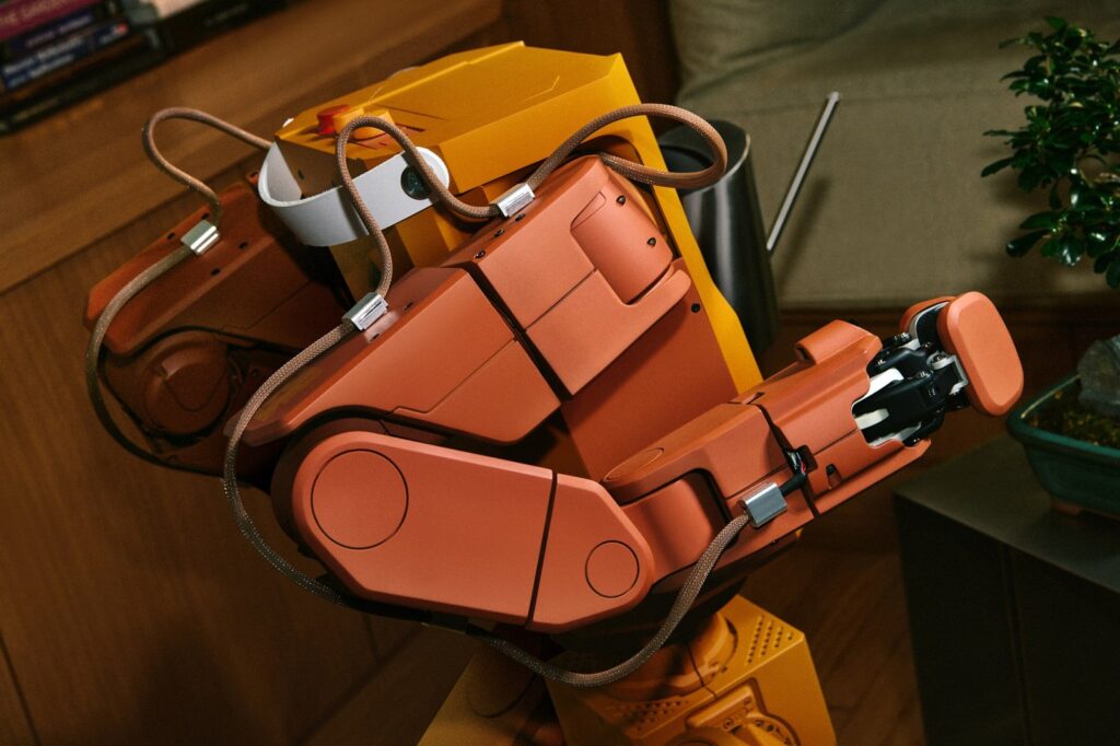 Voxel holding a watering can, close up of its boxy arms (Tuesday Labs)