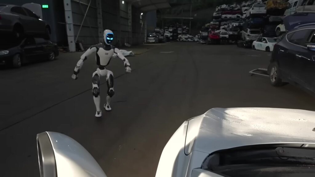 H2-X walks toward the camera between parked cars at night (Unitree Robotics, official video)